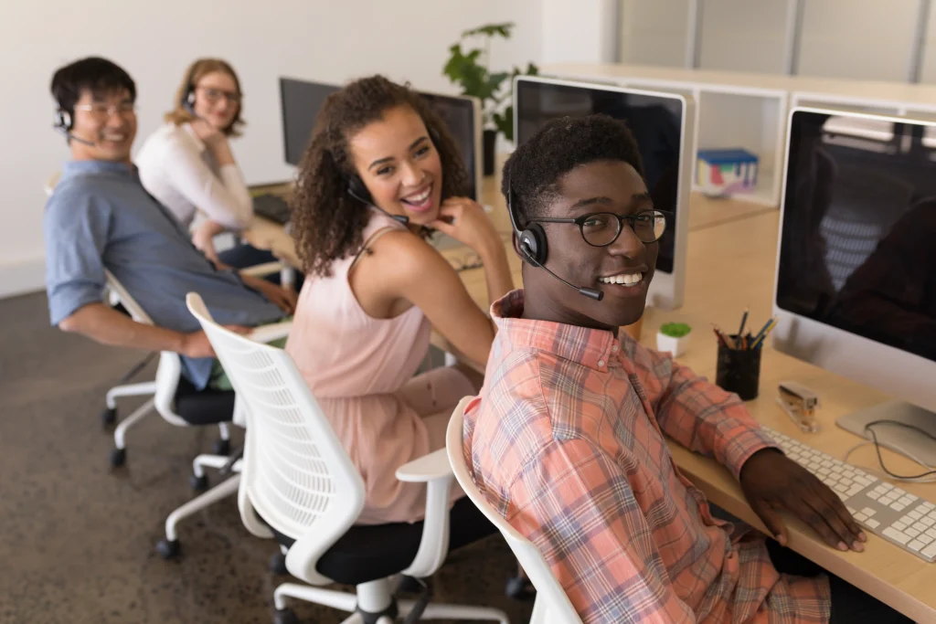 portrait-of-young-diverse-executives-in-headset-wo-2023-11-27-05-06-30-utc