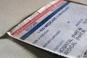 Close-up of a Medicare card showing contact information and details